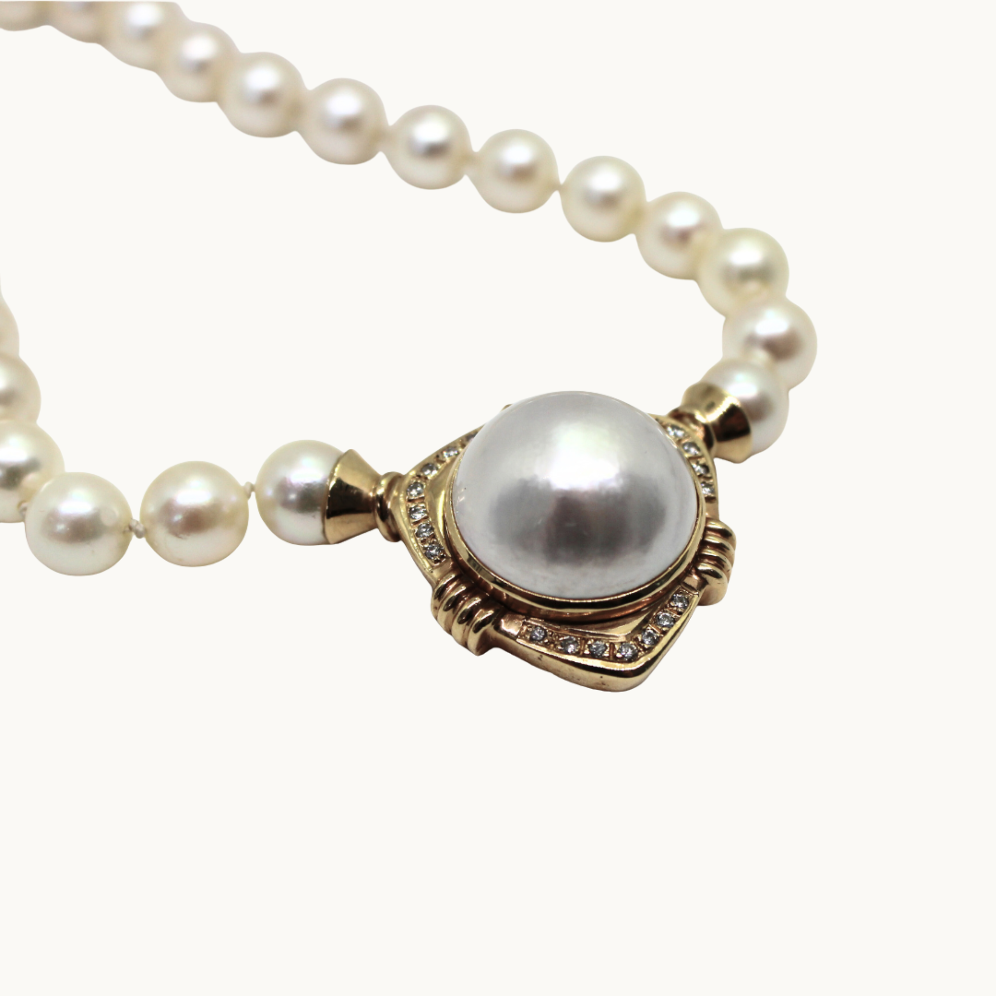Akoya cultured pearl necklace in 10K and 18K yellow gold with diamonds