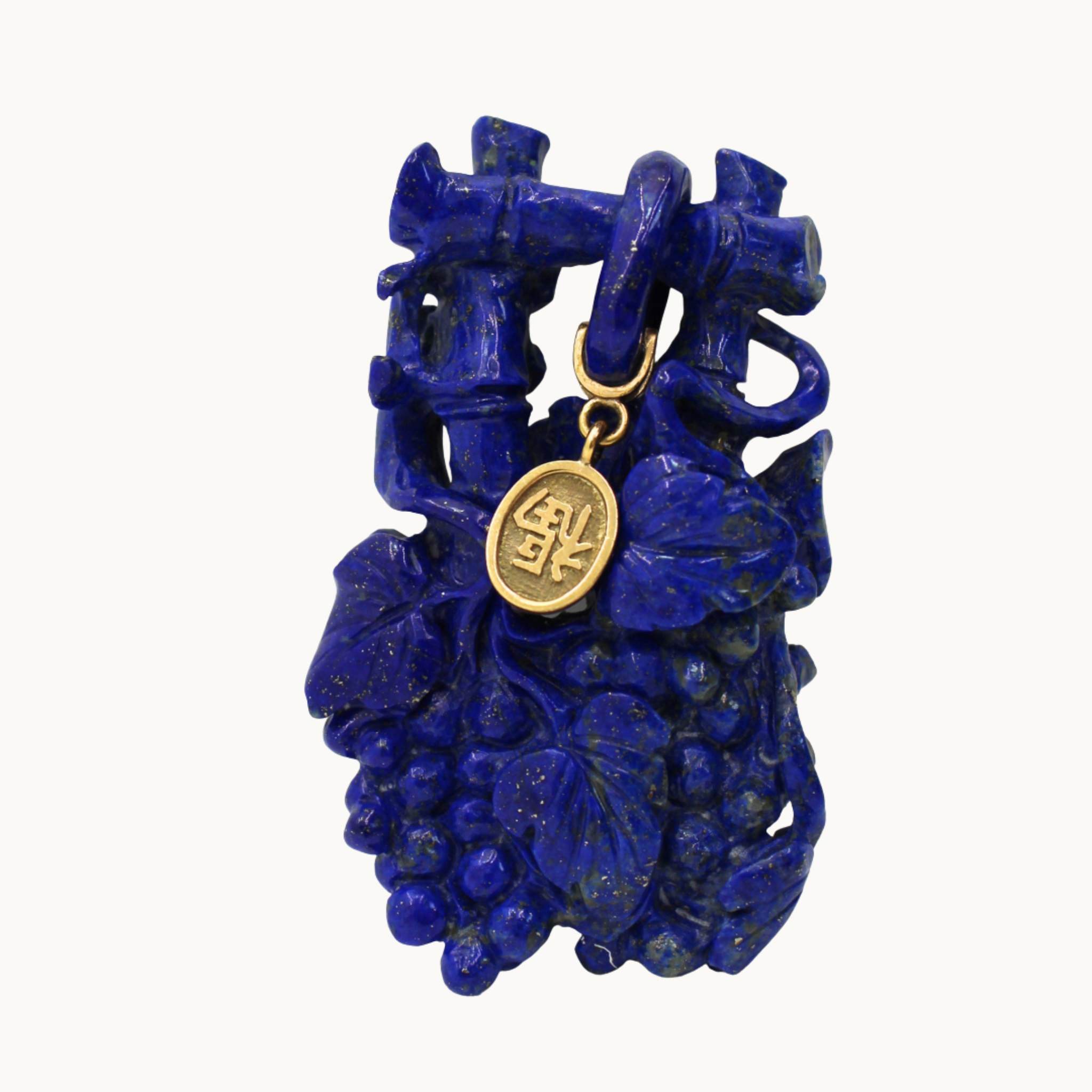 Lapis lazuli sculpture with 14K yellow gold