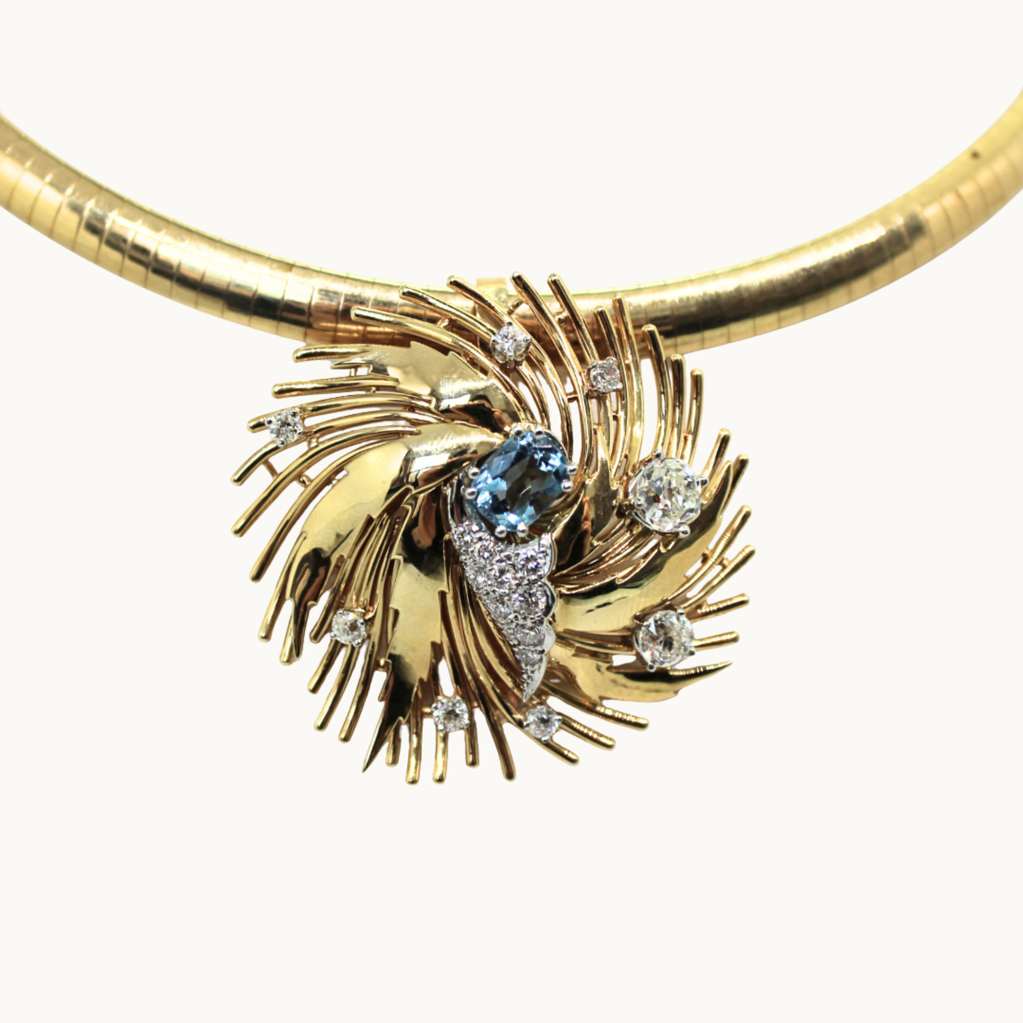 Rigid necklace in 14K yellow gold and pendant in 18K gold with aquamarine and diamonds