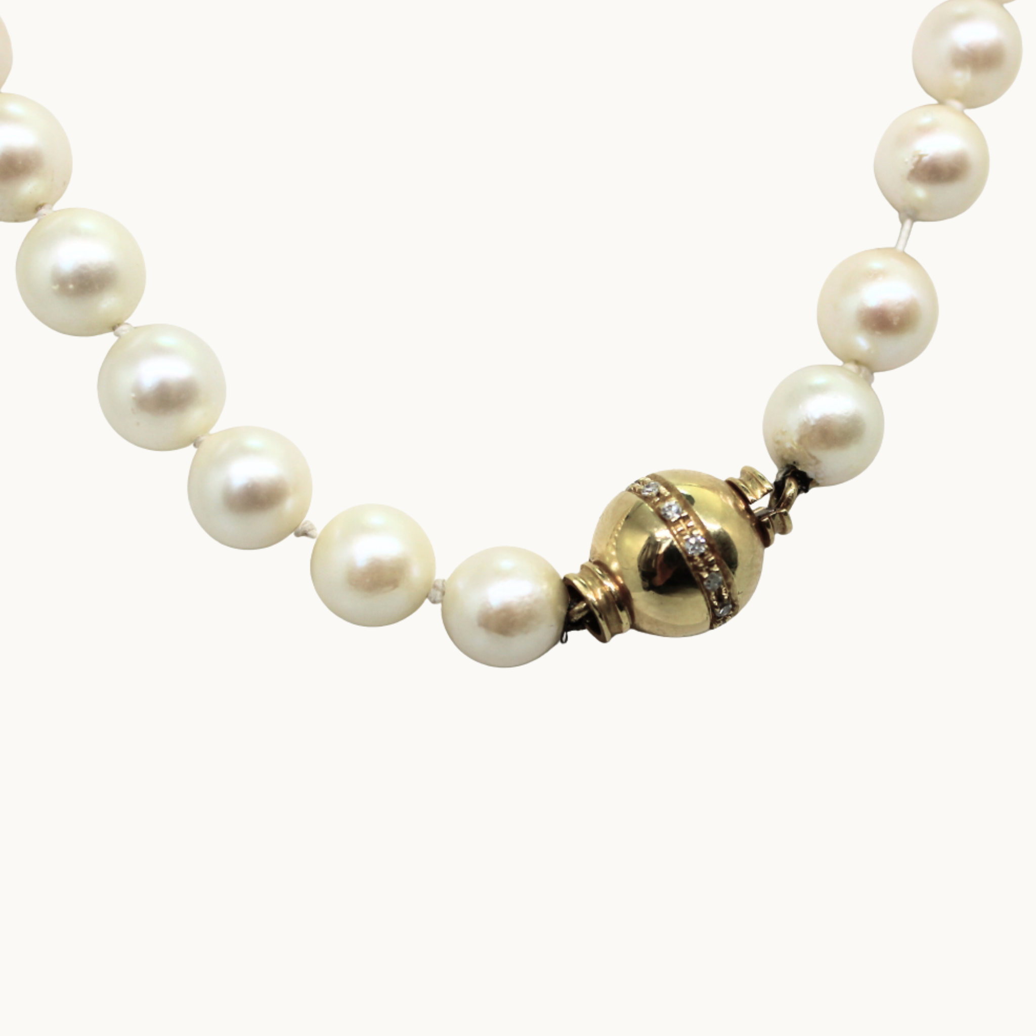 Akoya cultured pearl necklace in 10K and 18K yellow gold with diamonds