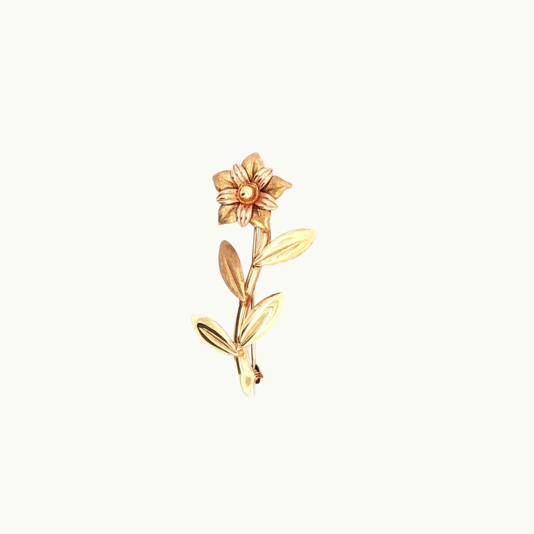 Floral brooch in 18K yellow and rose gold