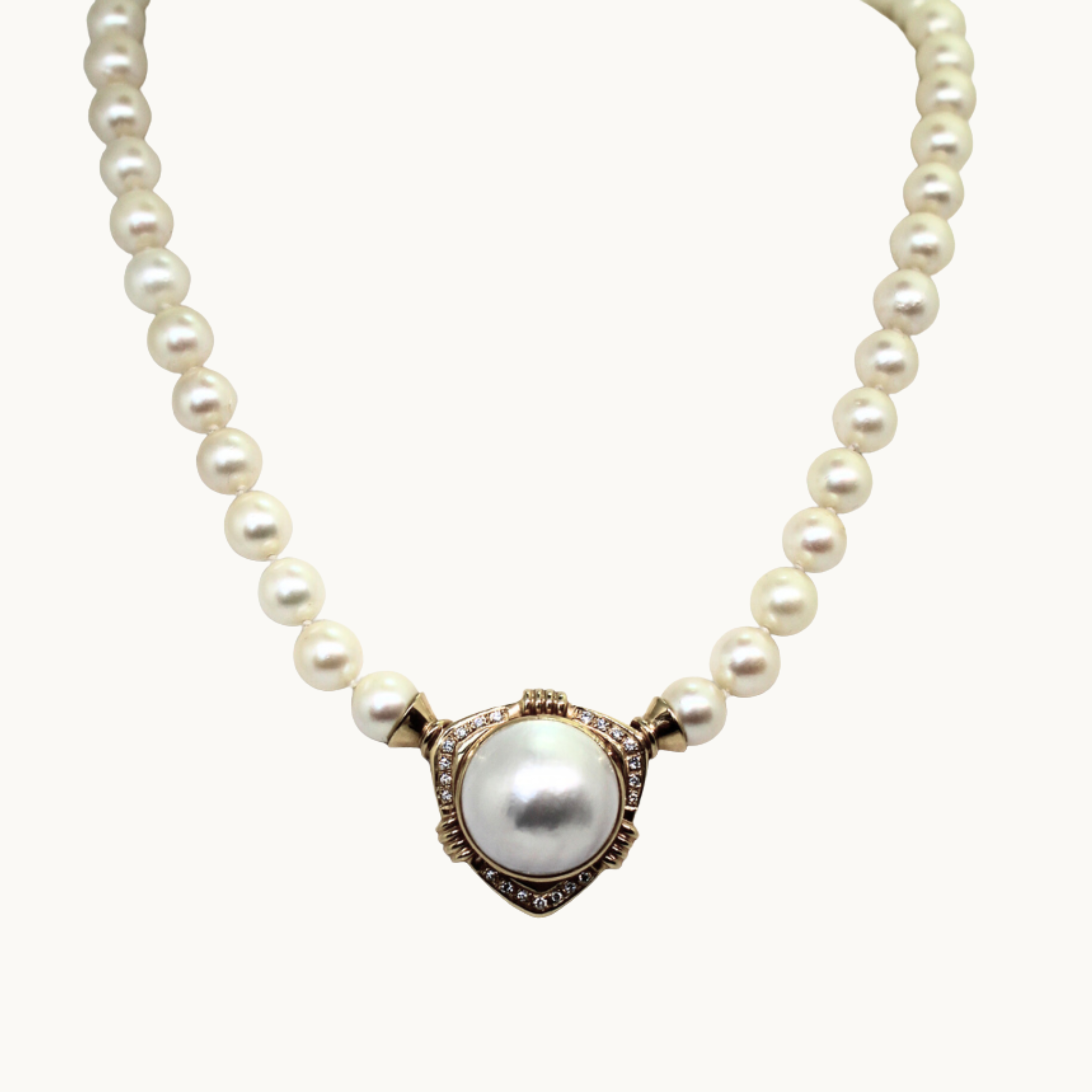 Akoya cultured pearl necklace in 10K and 18K yellow gold with diamonds