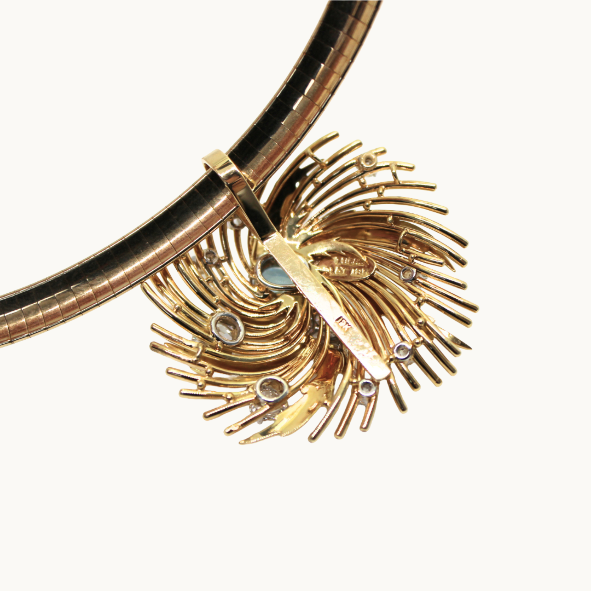 Rigid necklace in 14K yellow gold and pendant in 18K gold with aquamarine and diamonds