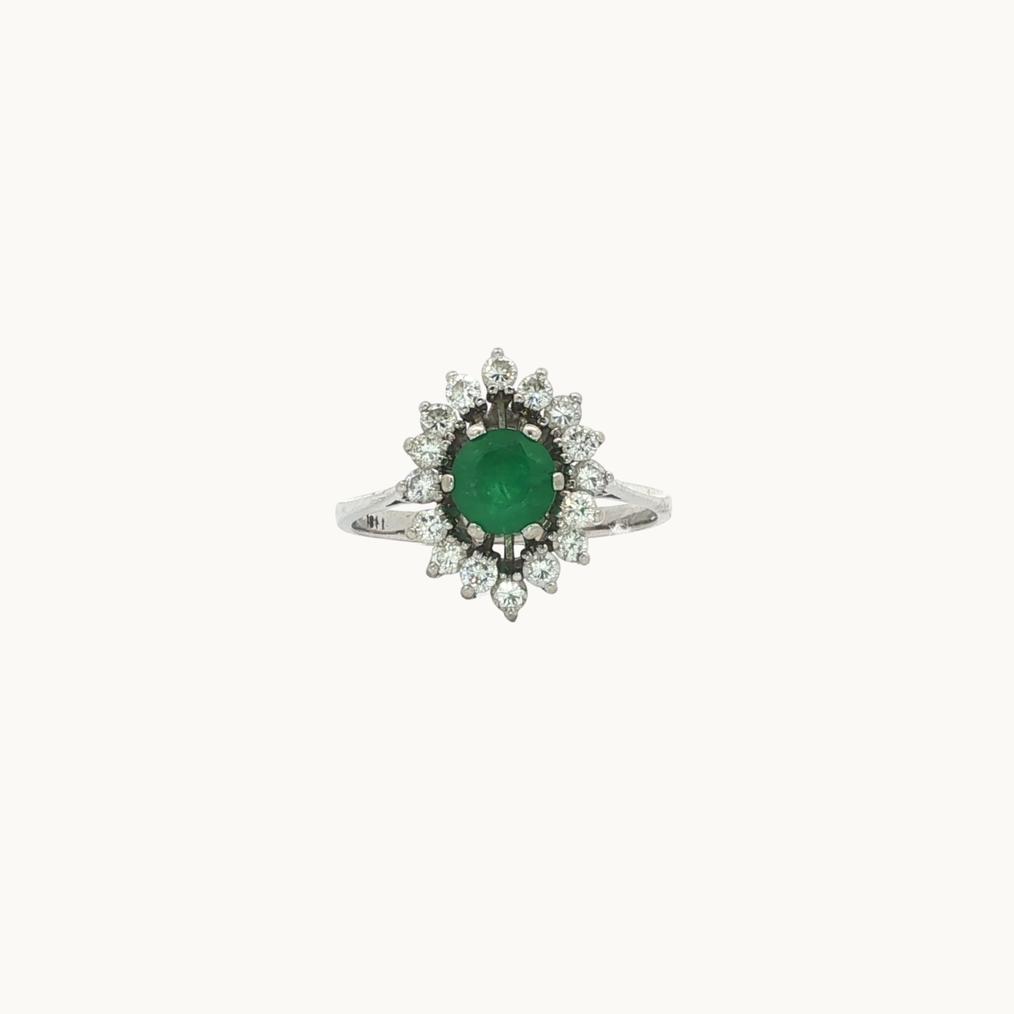 Halo ring in 18K white gold with emerald and diamonds