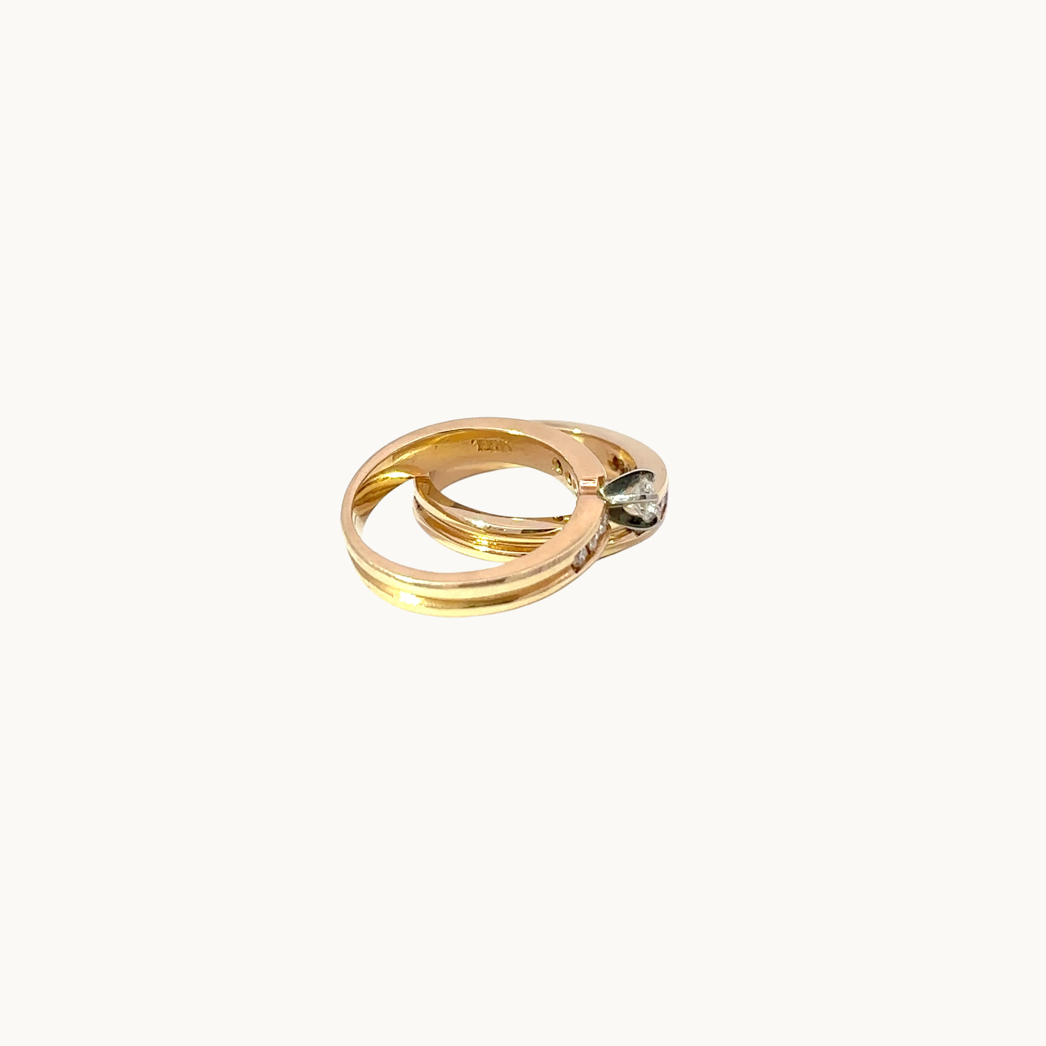 Solitaire and wedding band set in 14K yellow gold with diamonds