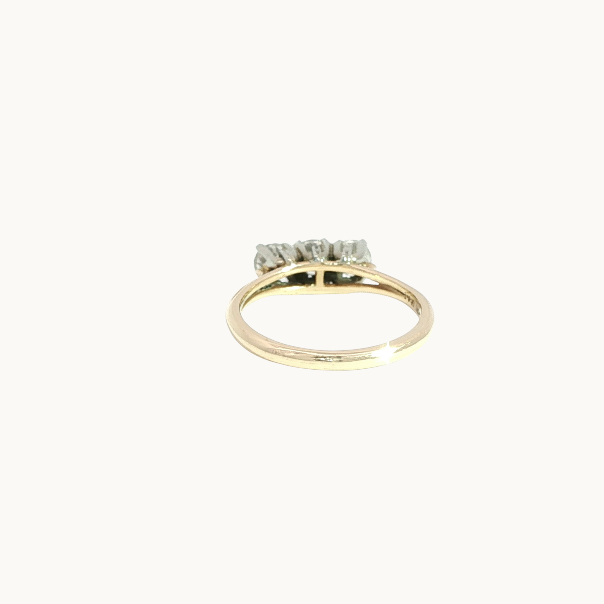 Trilogy ring in 14K white and yellow gold with diamonds