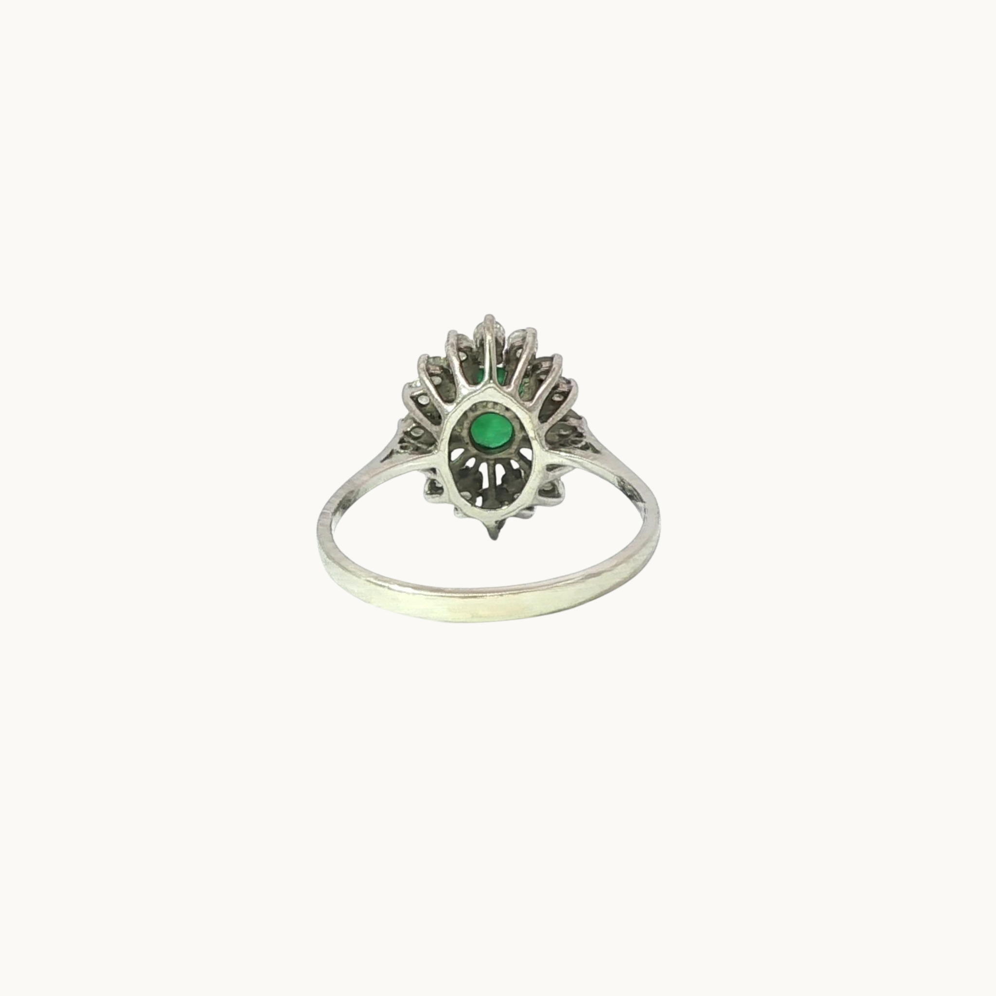 Halo ring in 18K white gold with emerald and diamonds