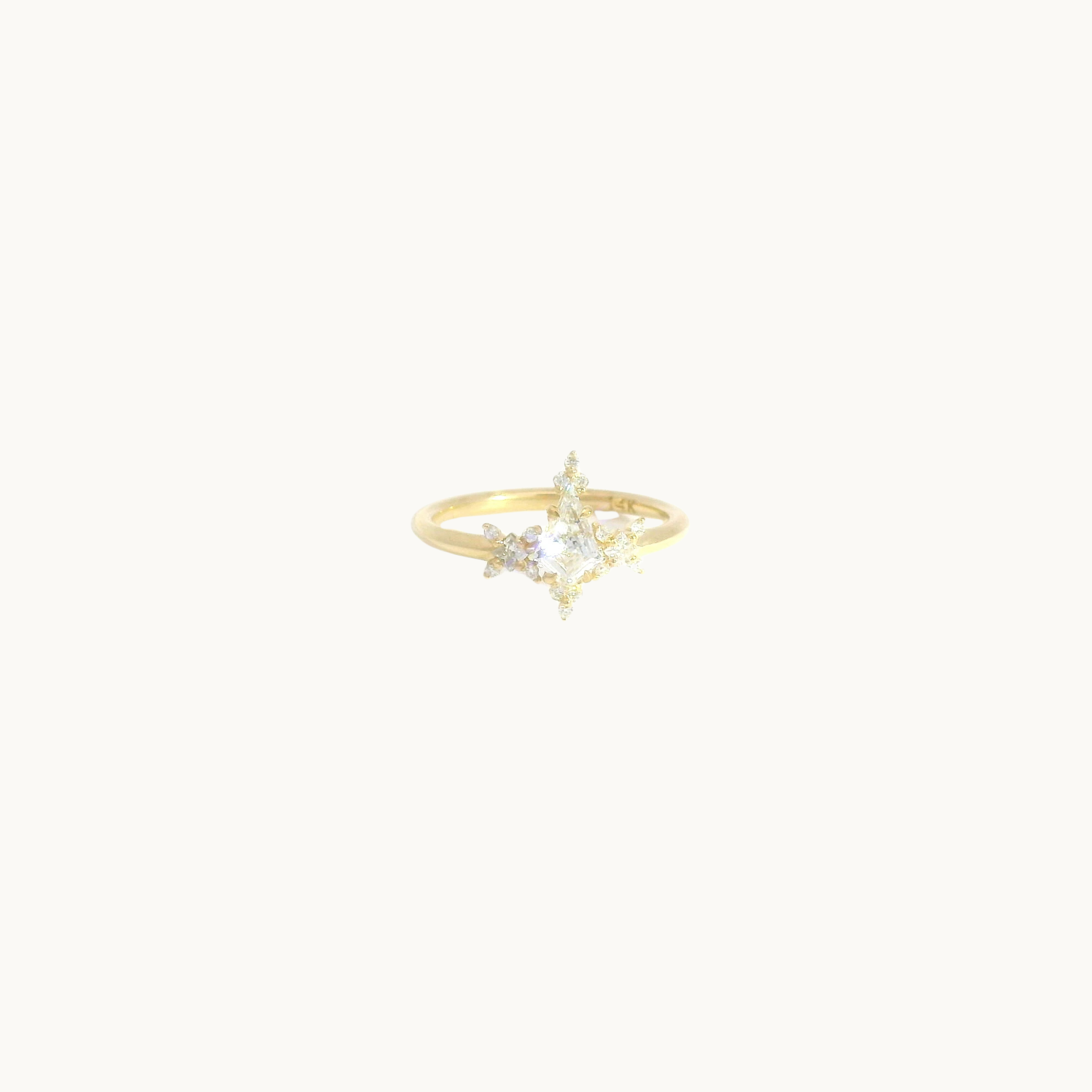 14K yellow gold star-shaped ring with diamonds
