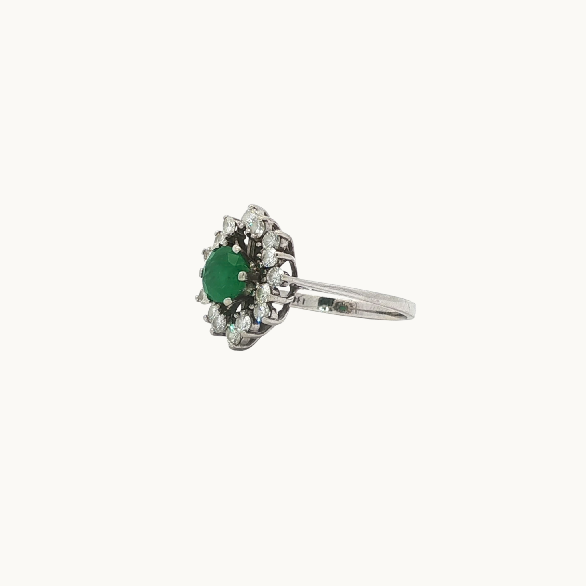 Halo ring in 18K white gold with emerald and diamonds