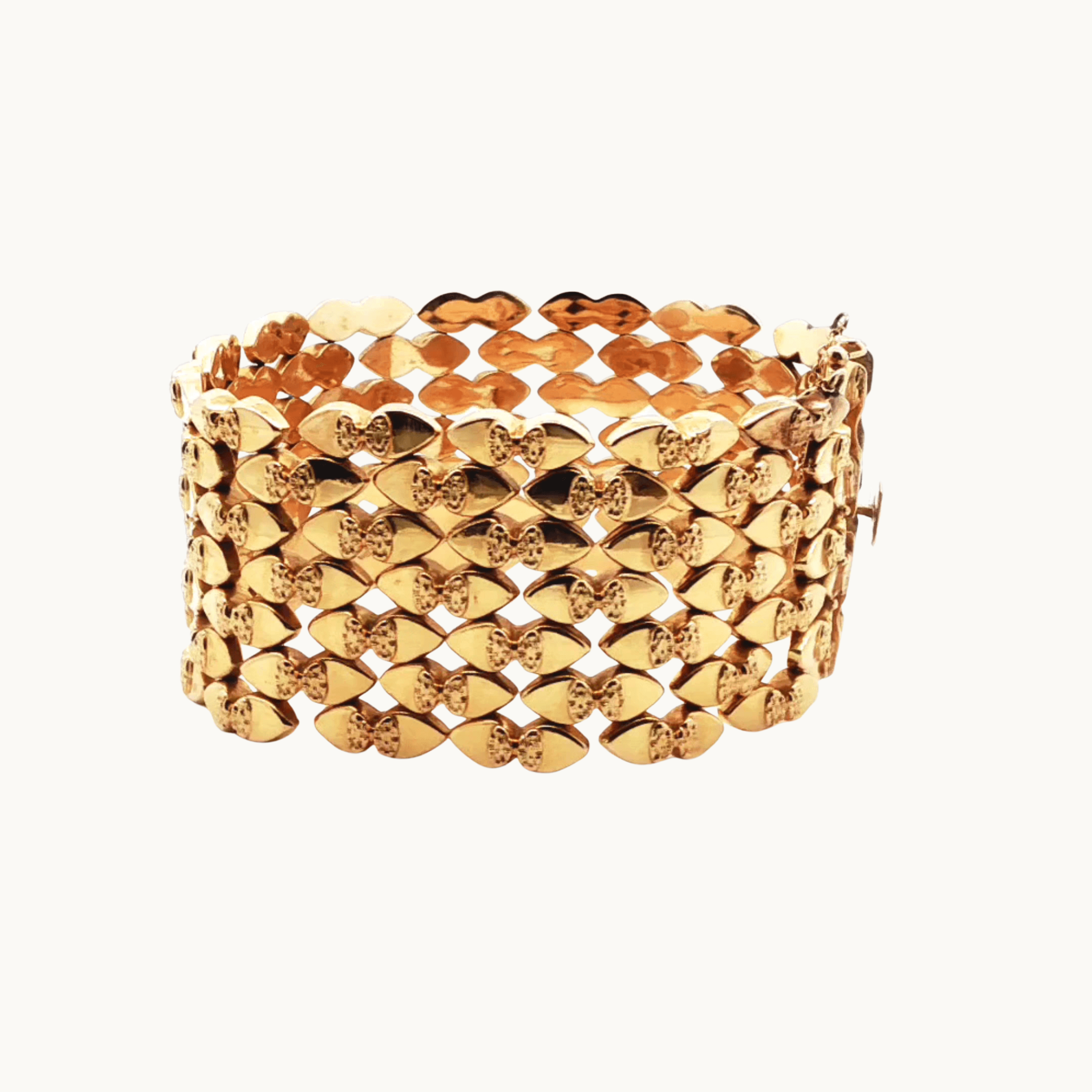 Semi-flexible cuff bracelet in 18K yellow gold
