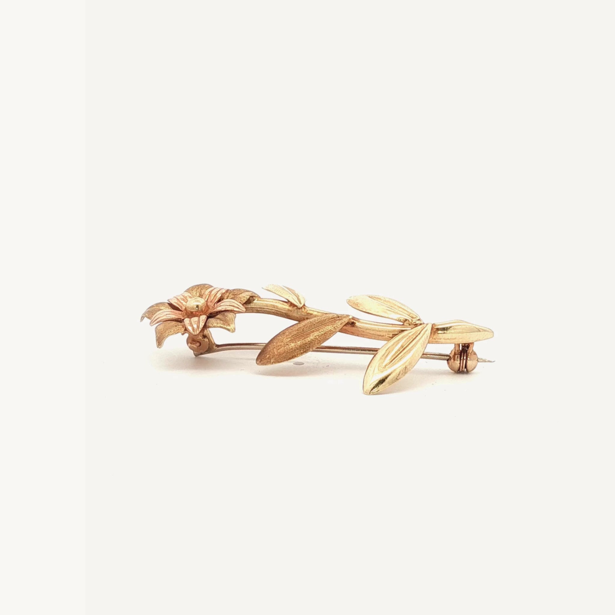Floral brooch in 18K yellow and rose gold